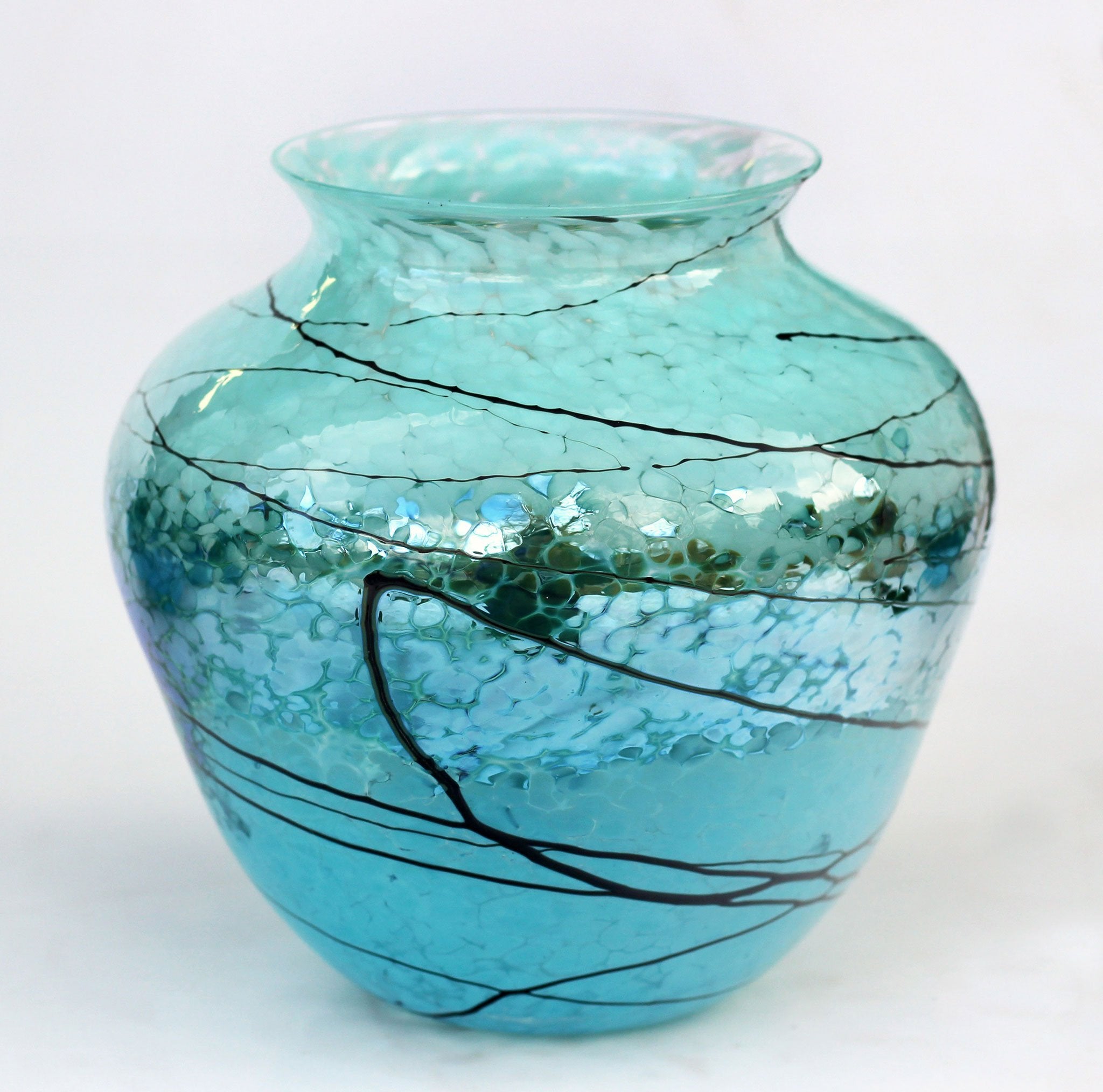 https://www.sweetheartgallery.com/cdn/shop/products/Glass-Rocks-Dottie-Boscamp-Silver-Green-Lightning-Urn-Artisan-Handblown-Art-Glass-Vases.jpg?v=1613145935