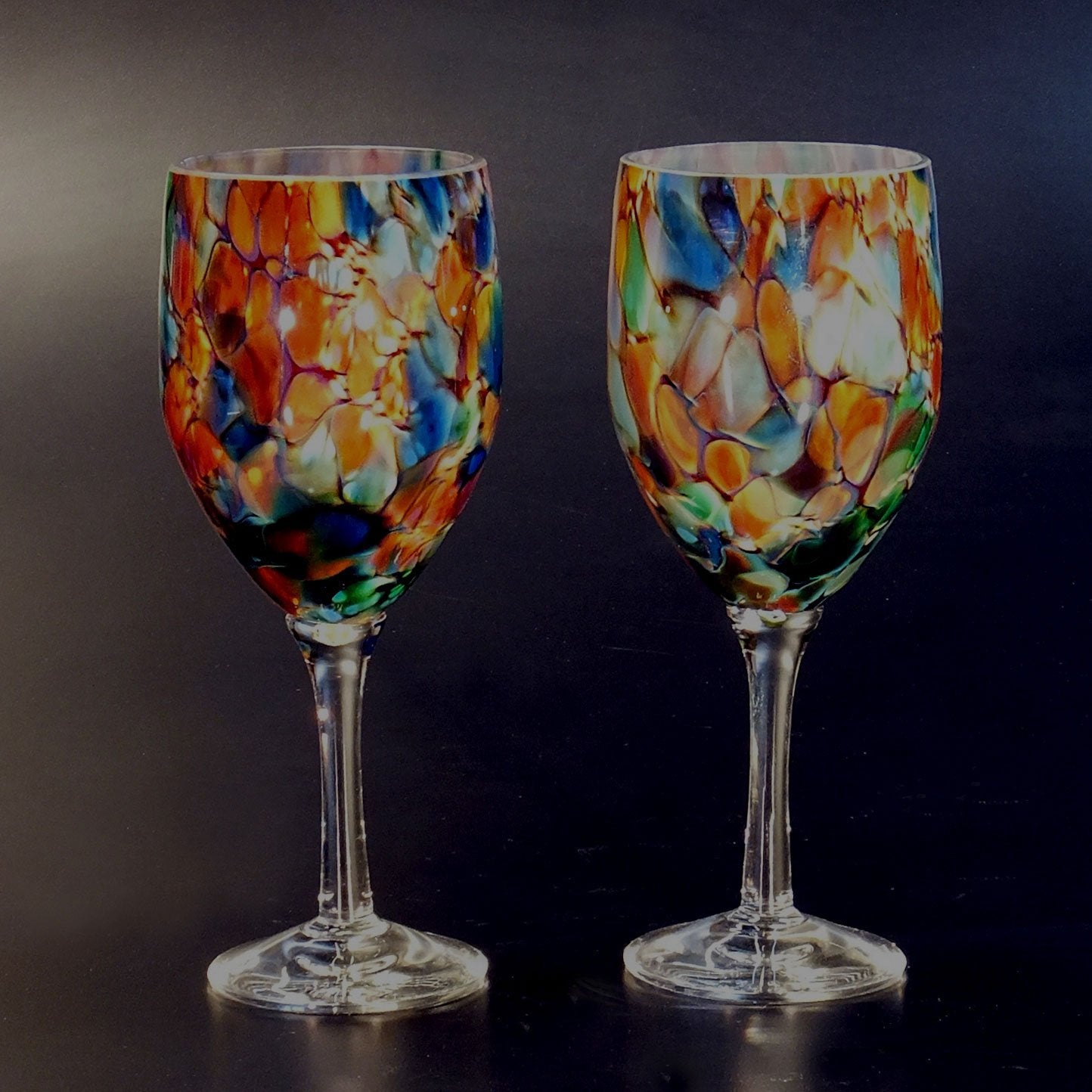 https://www.sweetheartgallery.com/cdn/shop/products/The-Glass-Forge-Wine-Glass-Shown-In-ET-Rainbow-Artistic-Functional-Artisan-Handblown-Art-Glass-Barware-Drinkware.jpg?v=1521556696